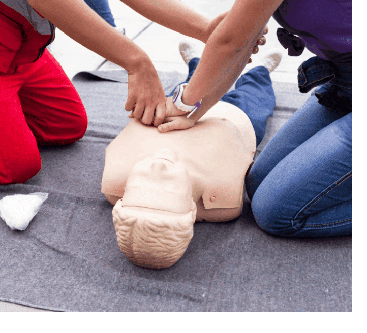 A person is performing cpr on an infant dummy.
